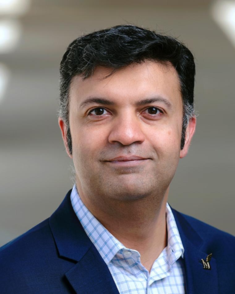 Dr. Ali K. Raz headshot